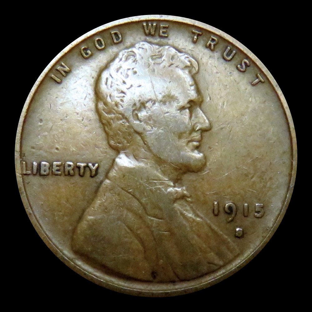 The thin scratch across the face of this 1915-D Lincoln cent is considered damage