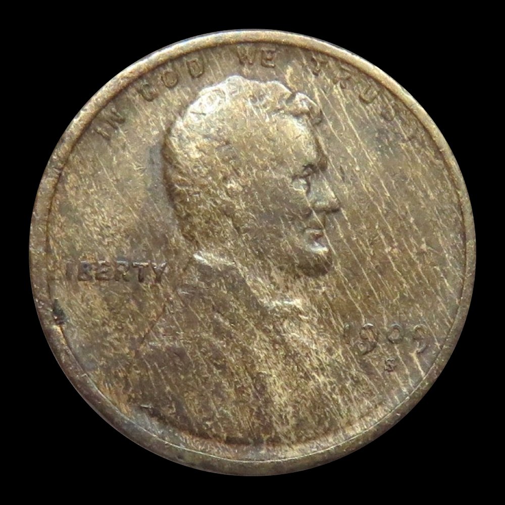 The woodgrain effect of a poorly mixed planchet on this 1909-S Lincoln cent